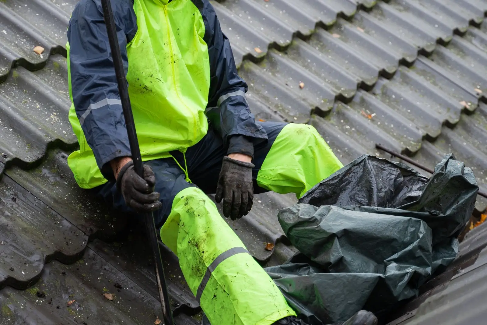 Worker on a metal panel roof